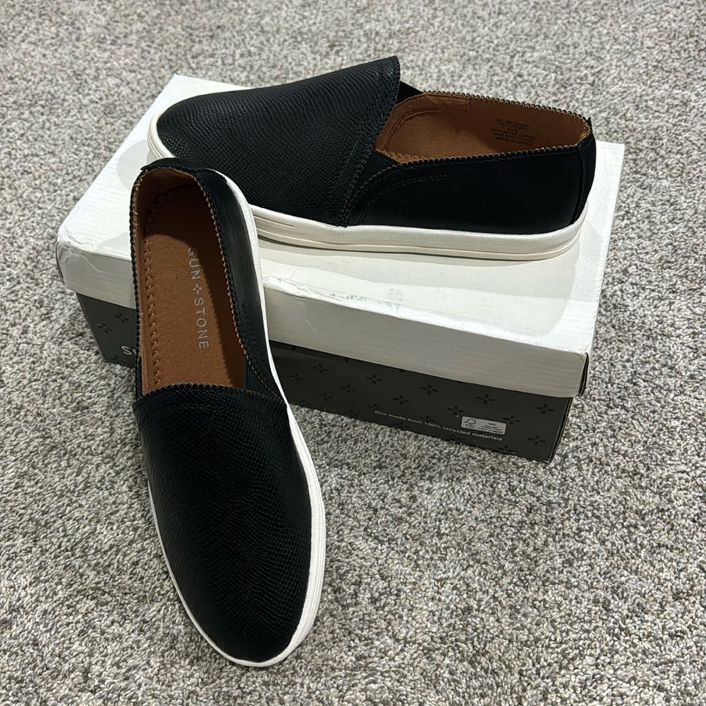 Black snakeskin slip on flats